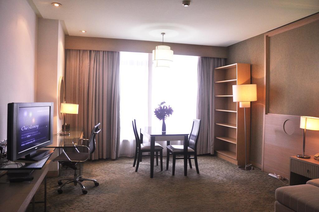 Hotel Nikko Tianjin Buitenkant foto A suite at the hotel