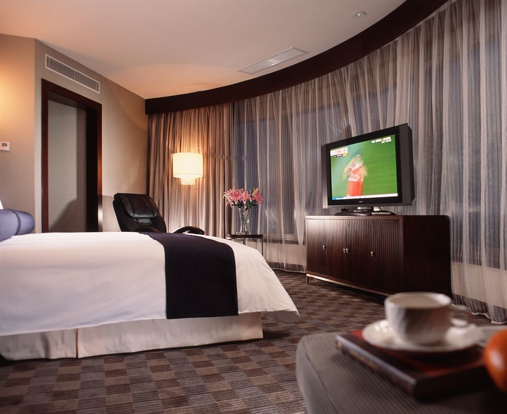 Hotel Nikko Tianjin Buitenkant foto A suite at the hotel